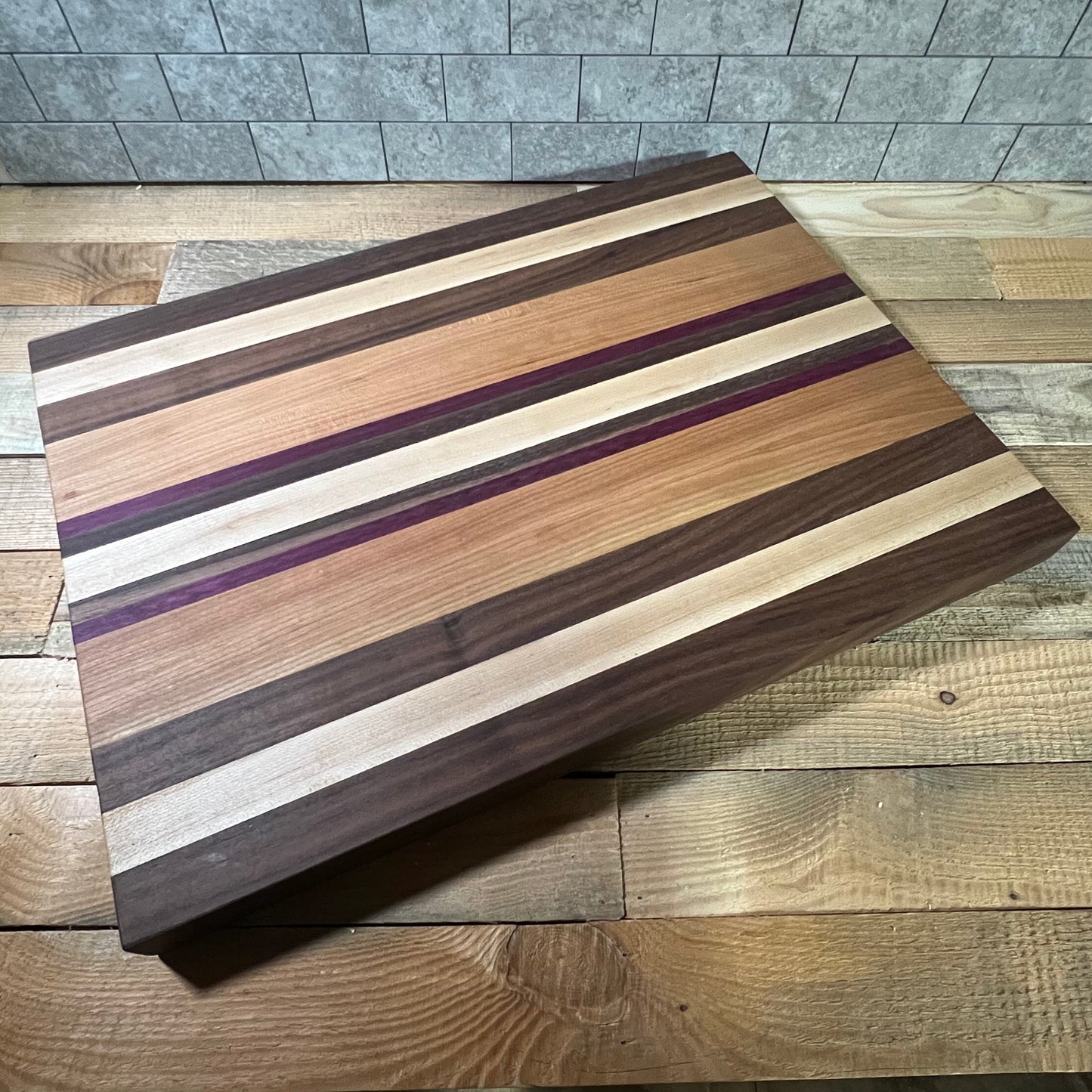 Coat of Many Colors Cutting Board