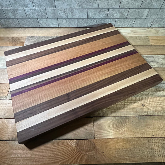 Coat of Many Colors Cutting Board